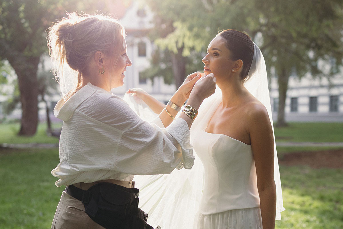 Bridal touch-up service – Tanja Naumann refreshes the bride’s makeup during the wedding day.